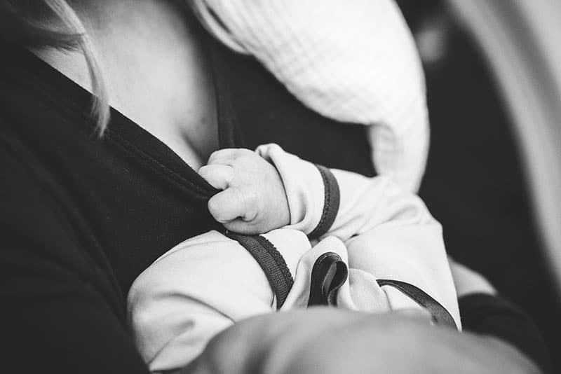Why does baby keep pulling away while breastfeeding?